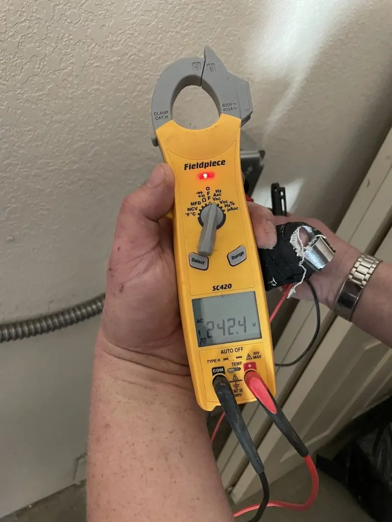 Voltage testing with clamp meter during Outlet Installation in Whitemarsh Island
